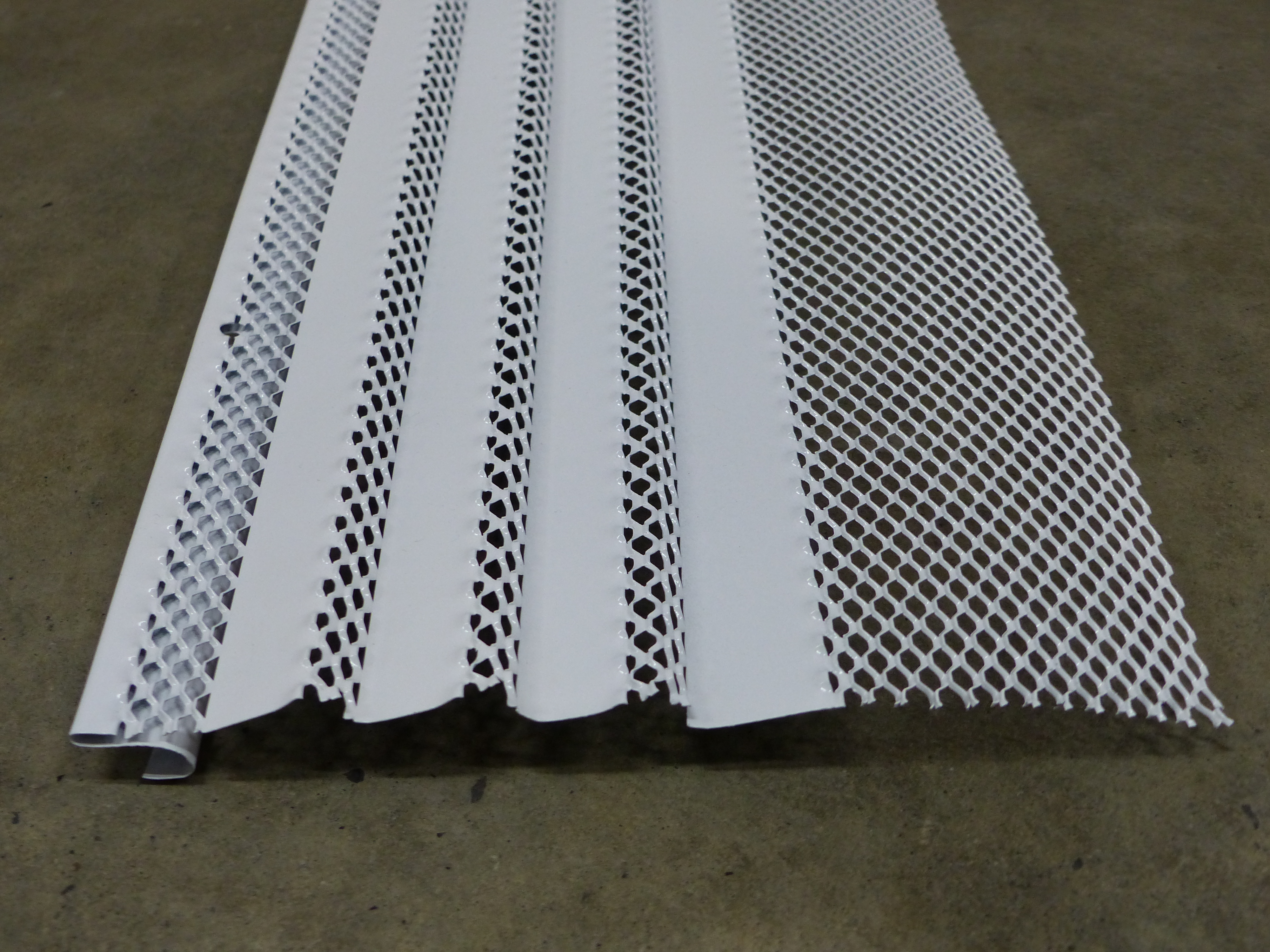 Coated steel mesh gutter guard, the type used to cover rain gutters and keep out leaves and debris